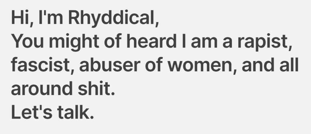 Screenshot of the heading from The Suck. Hi, I'm Rhyddical, You might of heard I am a rapist, fascist, abuser of women, and all around shit. Let's talk.